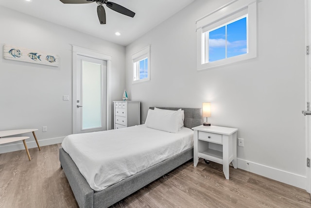 bedroom featuring ceiling fan and wood-type flooring