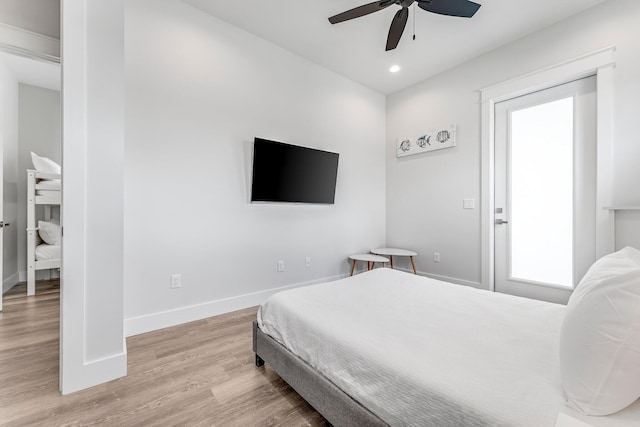 bedroom featuring ceiling fan and light hardwood / wood-style flooring