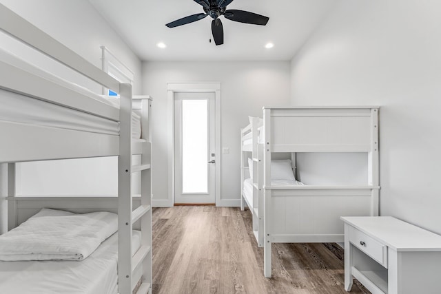 bedroom with ceiling fan and hardwood / wood-style flooring