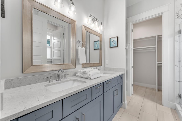 bathroom featuring tile patterned flooring and vanity