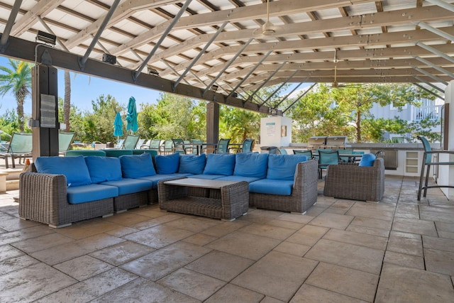 view of patio / terrace featuring a gazebo, exterior kitchen, and an outdoor living space