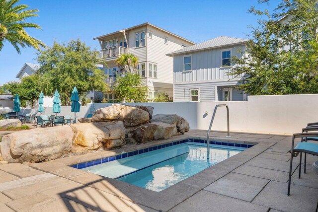 view of swimming pool with a patio area