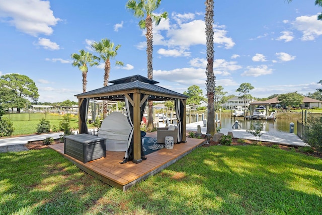 view of dock featuring a water view and a yard