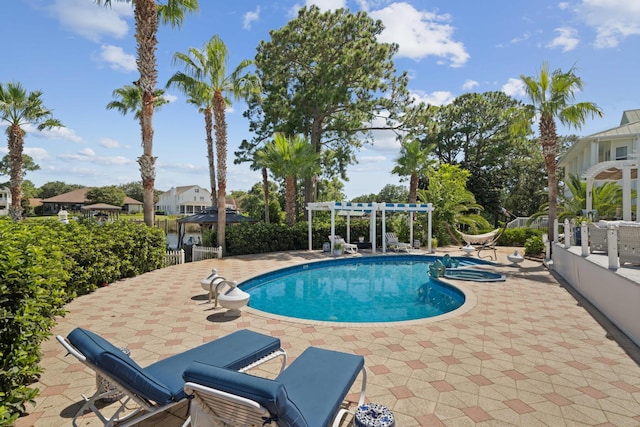 view of pool with a pergola and a patio