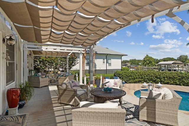 view of patio featuring a fenced in pool, an outdoor hangout area, and a pergola