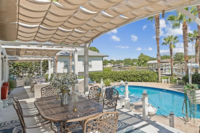 view of pool with a patio area and a pergola