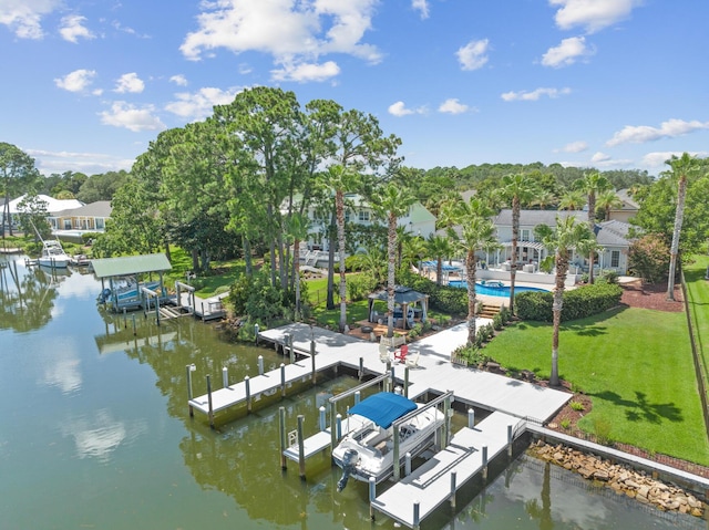 dock area featuring a water view, a pool, and a lawn