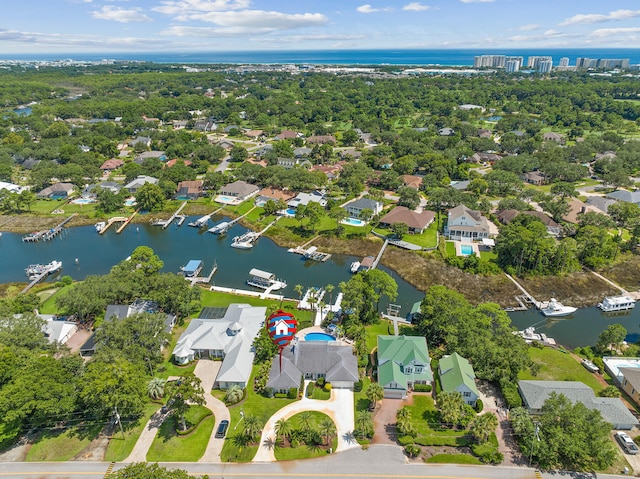 birds eye view of property with a water view