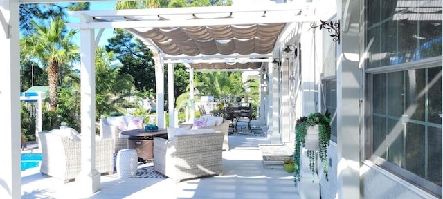 view of patio featuring a pergola and outdoor lounge area