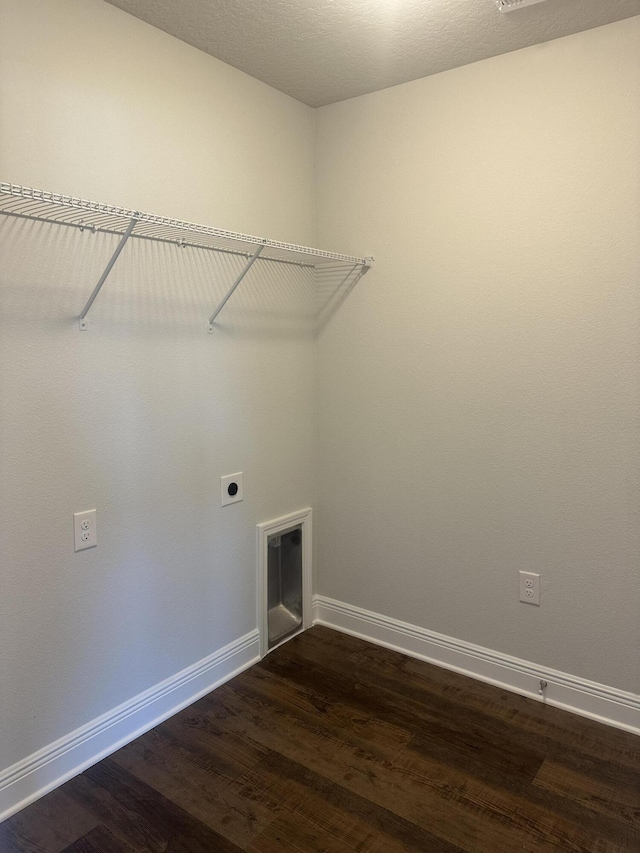 washroom with laundry area, dark wood-style flooring, electric dryer hookup, and baseboards