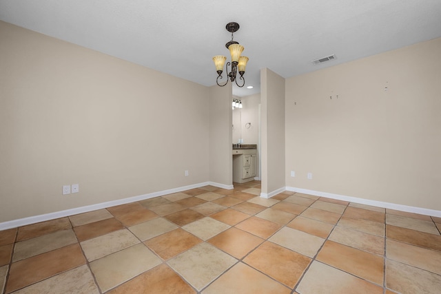 interior space featuring an inviting chandelier and light tile patterned floors