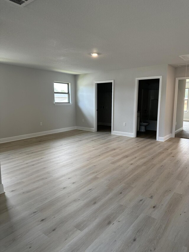 unfurnished living room featuring light wood-type flooring