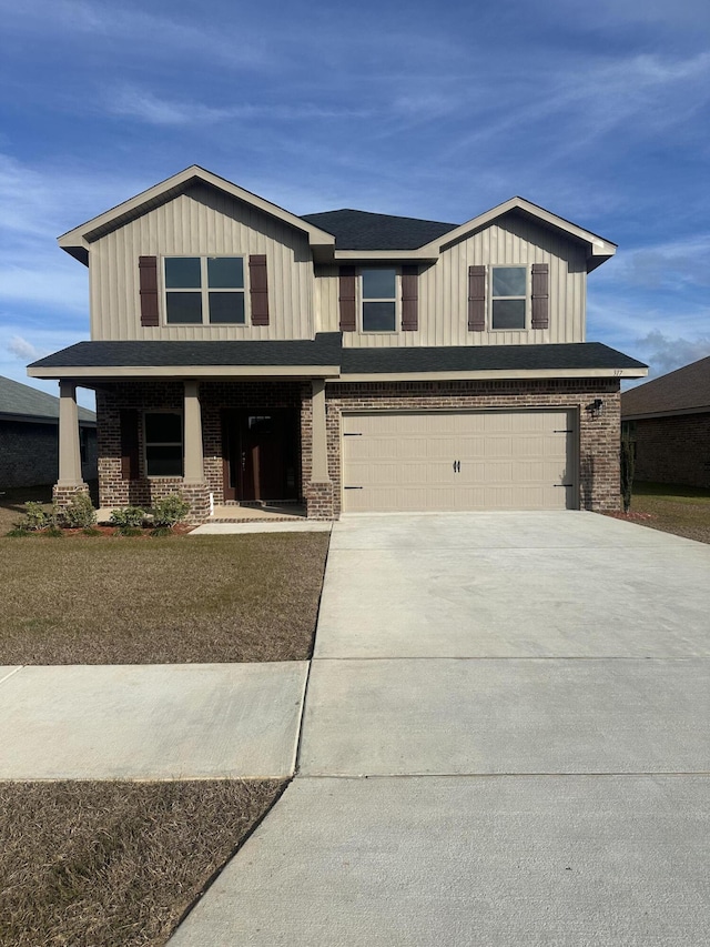 view of front of home featuring a garage and covered porch