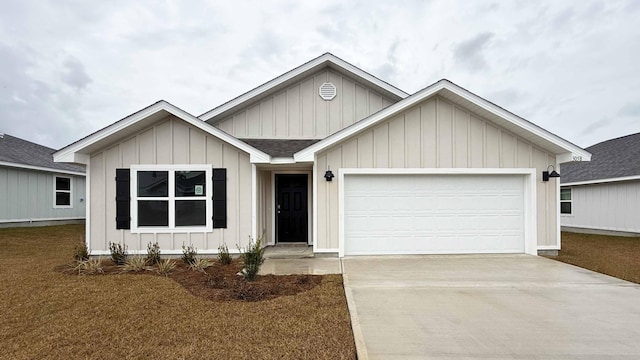 view of front of property with a front yard and a garage