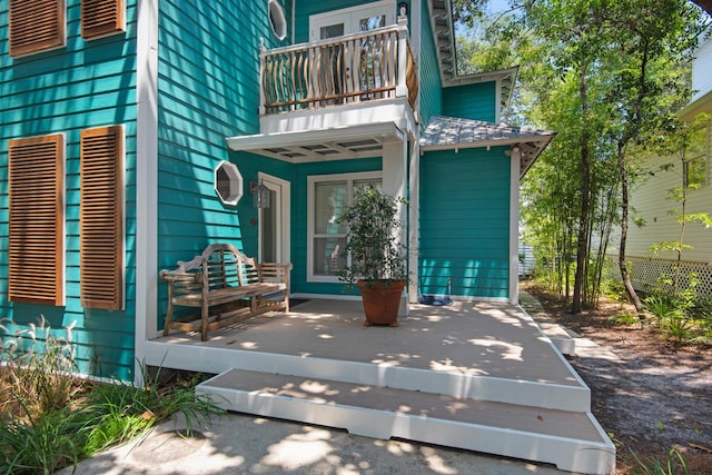 doorway to property featuring a balcony