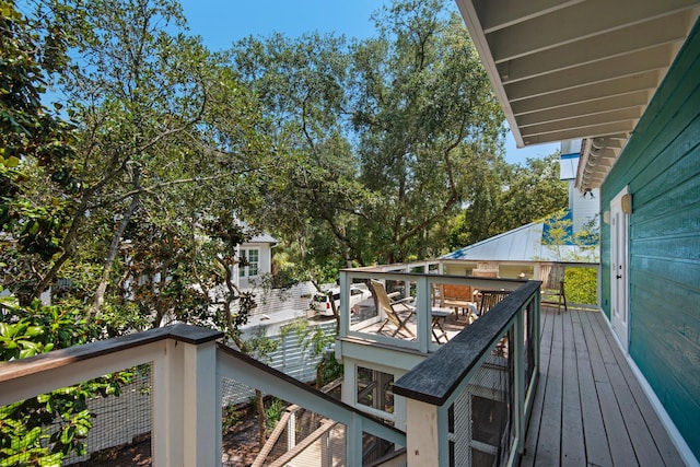 wooden deck featuring outdoor dining space