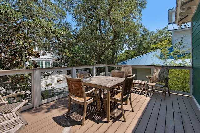 deck featuring outdoor dining area