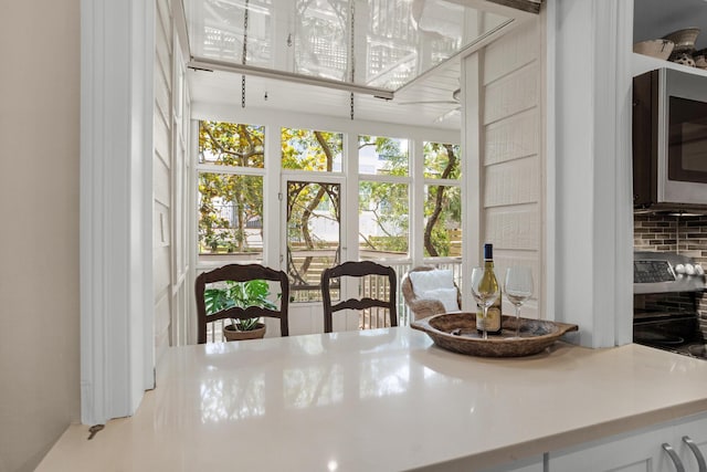 interior space featuring light countertops and appliances with stainless steel finishes