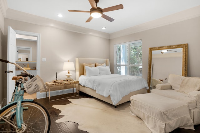 bedroom featuring ornamental molding, ceiling fan, and hardwood / wood-style floors