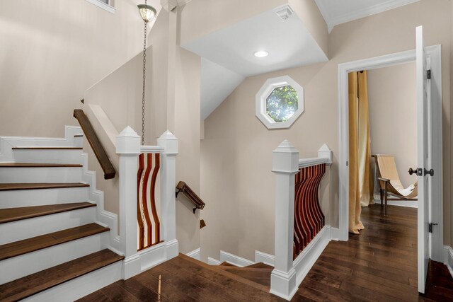 stairway featuring dark hardwood / wood-style floors and lofted ceiling