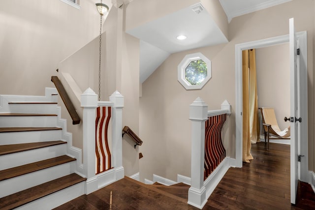 staircase with wood-type flooring and baseboards