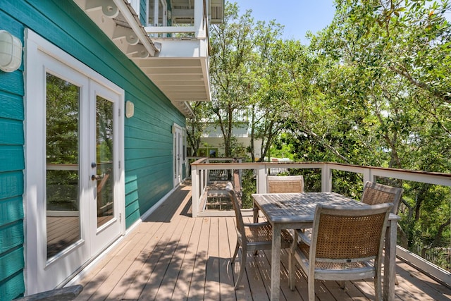 wooden terrace with outdoor dining area