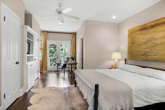 bedroom with dark hardwood / wood-style flooring, ceiling fan, and french doors