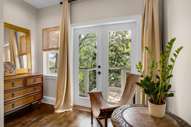 entryway with dark wood-style floors and baseboards