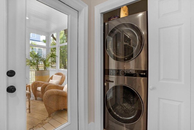 laundry area with stacked washer and dryer