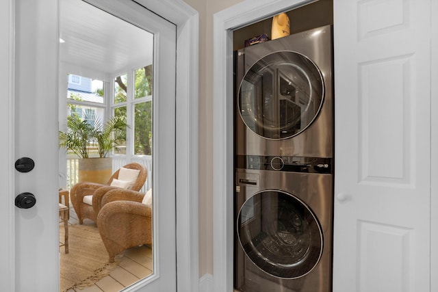 laundry area featuring laundry area and stacked washer and clothes dryer