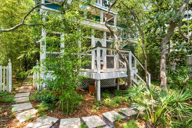 view of home's exterior with a wooden deck