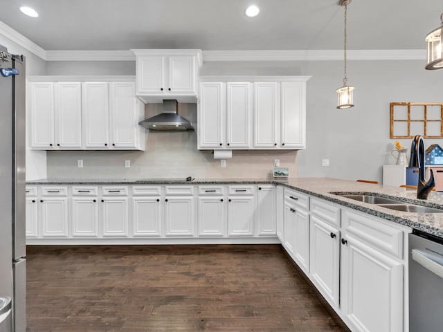 kitchen featuring stainless steel appliances, decorative light fixtures, white cabinets, and wall chimney exhaust hood