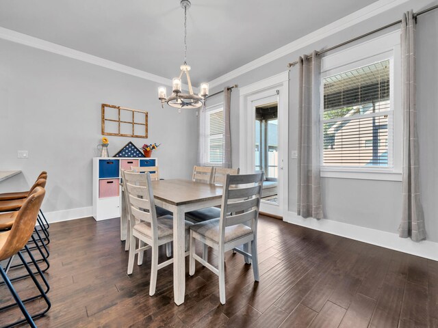 dining space featuring an inviting chandelier, ornamental molding, dark wood-type flooring, and a wealth of natural light