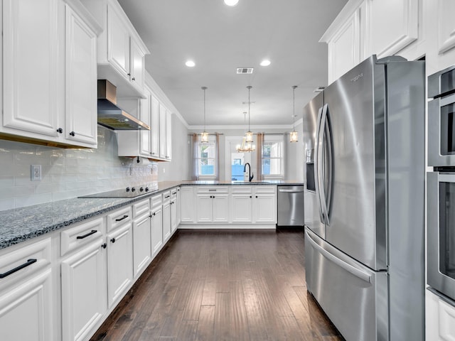 kitchen featuring stainless steel appliances, ventilation hood, pendant lighting, and white cabinets