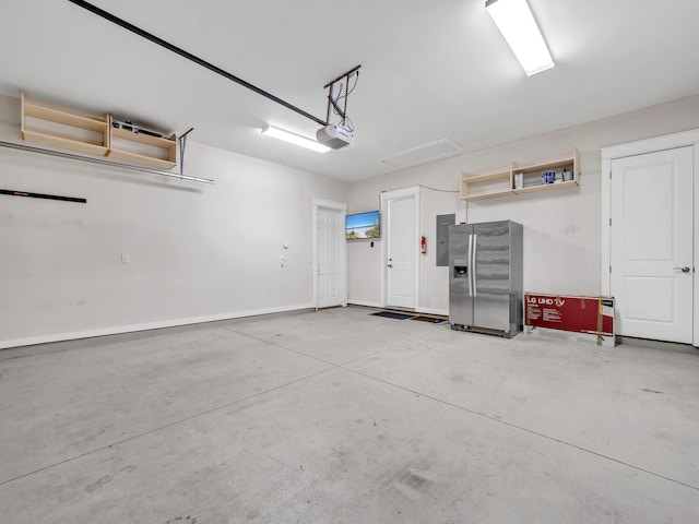 garage with a garage door opener, stainless steel fridge, and electric panel