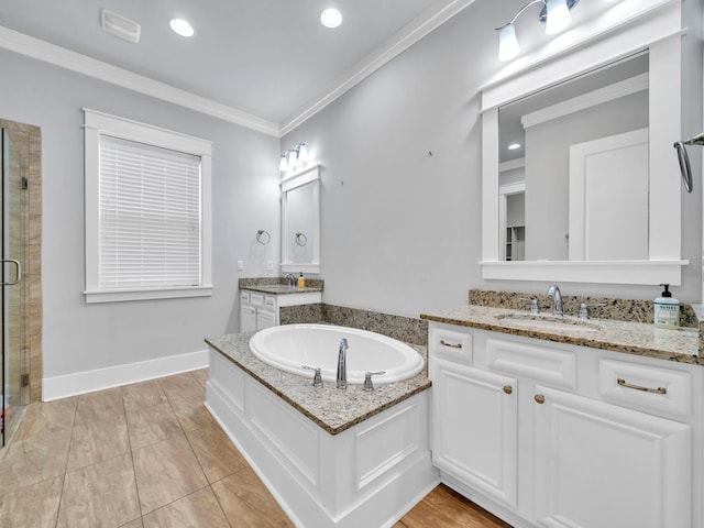 bathroom featuring crown molding, separate shower and tub, and vanity