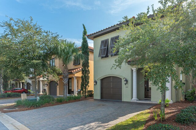 mediterranean / spanish house with a garage