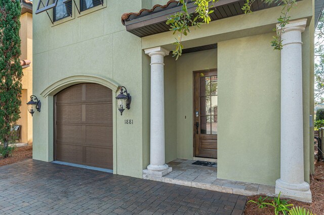 doorway to property featuring a garage