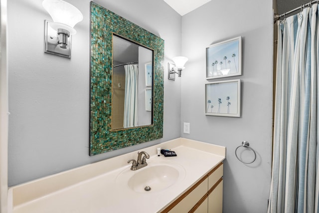 bathroom with vanity and a shower with shower curtain