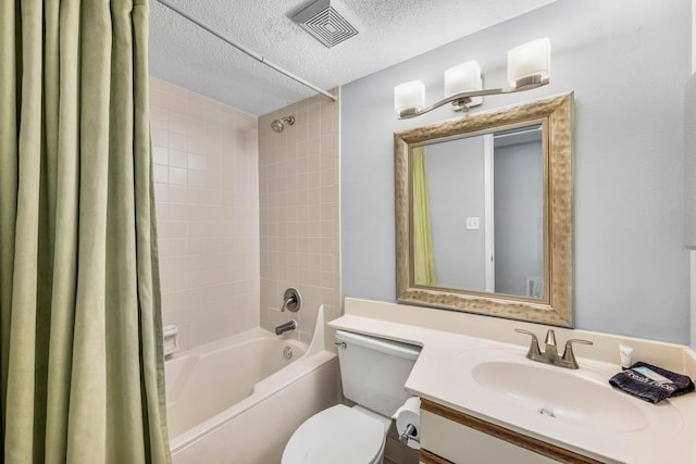 full bathroom with vanity, shower / bath combo, toilet, and a textured ceiling