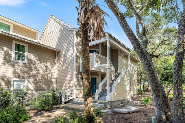 rear view of property featuring a balcony