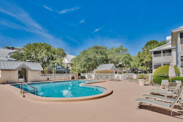 view of swimming pool featuring a patio area