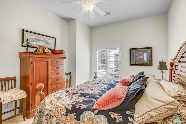 bedroom with light carpet and ceiling fan