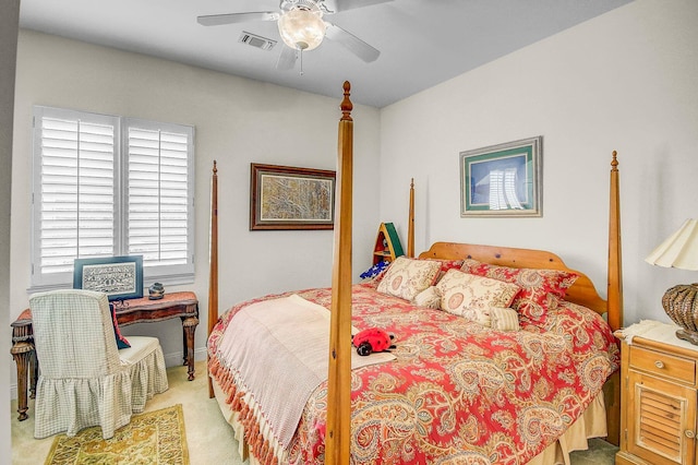 carpeted bedroom featuring multiple windows and ceiling fan