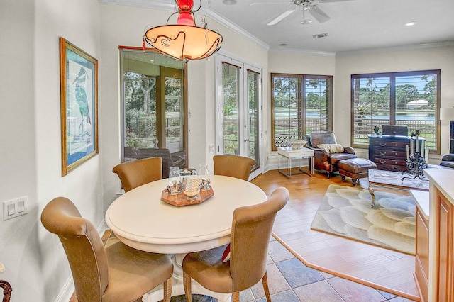 sunroom / solarium with french doors and ceiling fan