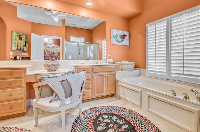 bathroom with separate shower and tub, vanity, and ceiling fan