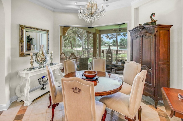 dining area with light tile patterned flooring, crown molding, and ceiling fan with notable chandelier