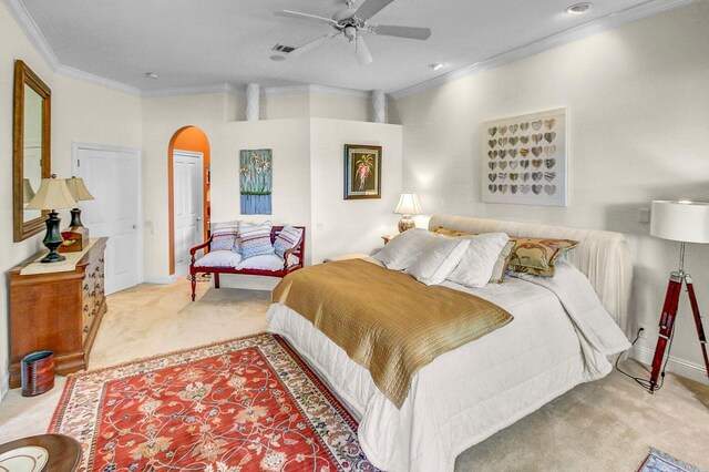 bedroom with crown molding, light colored carpet, a closet, and ceiling fan