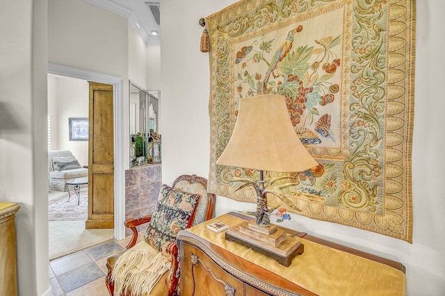 sitting room with ornamental molding