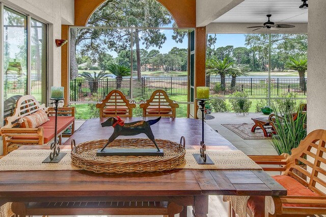 exterior space featuring ceiling fan